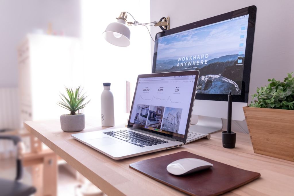 Modern workspace with laptop and monitor for WordPress Web Design Services