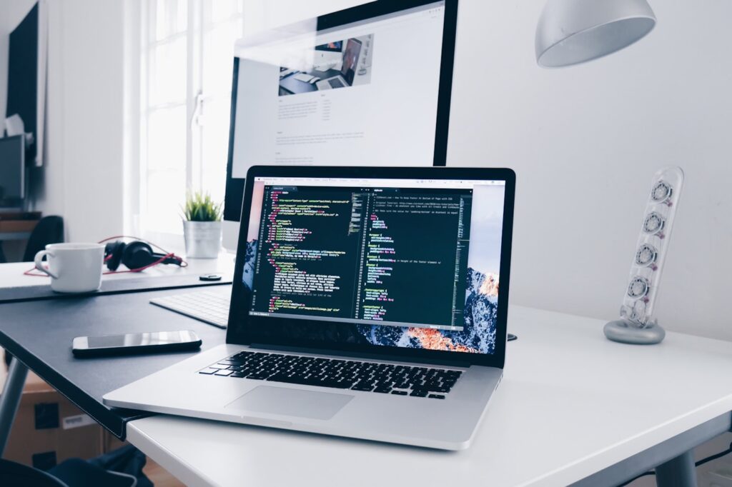 Laptop with code on screen for WordPress Web Design Services and Custom Development